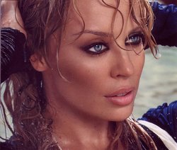 Kylie Minogue (2003), during filming of the music video "Slow", and used as the CD single cover for "Red Blooded Woman" (2004)