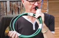 OAE Horn player Martin Lawrence making a hosepipe horn